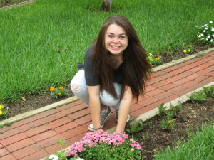 Carmen McCanna, a high school senior from Illinois, works on La Posada's flower garden.