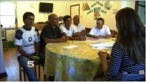 Cuban immigrants are interviewed by local media at La Posada Providencia.